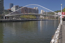 Spain, Basque Country, Bilbao, Zubizuri or White Bridge, tied arch footbridge across the Nervion River designed by Santiago Calatrava and opened in 1997.