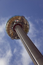 England, East Sussex, Brighton, Steel i360 observation tower on seafront promenade busy with summer tourists.