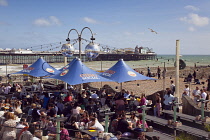 England, East Sussex, Brighton, OhSo Social bar and cafe on the seafront promenade busy with summer tourists.