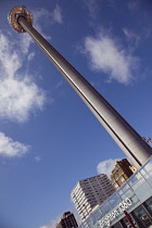 England, East Sussex, Brighton, Steel i360 observation tower on seafront promenade busy with summer tourists.