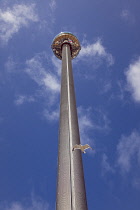 England, East Sussex, Brighton, Steel i360 observation tower on seafront promenade busy with summer tourists.