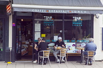 England, East Sussex, Brighton, Hove, Western Road, People Sat outside Take Turkish Cafe eating and drinking.