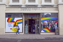 England, East Sussex, Brighton, Hove, Western Road, Exterior of Tesco Express convenience store decorated for Pride.