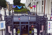 England, East Sussex, Brighton, Hove, Western Road, Entrance to Gwydr underground barber shop decorated with mutli coloured pants.