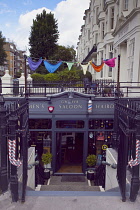 England, East Sussex, Brighton, Hove, Western Road, Entrance to Gwydr underground barber shop decorated with mutli coloured pants.