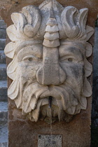Spain, Balearic Islands, Majorca, Palma de Mallorca, Old Town. Water fountain in the shape of an animal's head.