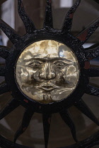 Spain, Balearic Islands, Majorca, Palma de Mallorca, Old Town. Metalic door detail in the shape of the face of the sun.
