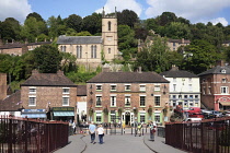 England, Shropshire, Ironbridge, Town seen from the Grade 1 listed Cast Iron footbridge over the river Severn.