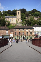 England, Shropshire, Ironbridge, Town seen from the Grade 1 listed Cast Iron footbridge over the river Severn.