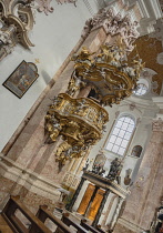 Austria, Tyrol, Innsbruck, Dom zu St Jakob or Cathedral of St James, baroque pulpit by Nikolaus Moll dating from 1725 with the tomb of Archduke Maximilian III in the background.