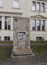 Germany, Berlin, Hamburger Bahnhof former railway station now acontemporary art museum, the Museum für Gegenwart. Section of Berlin Wall with ATM cash machine.