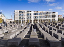 Germany, Berlin, Mitte, Holocaust Memorial designed by US architect Peter Eisenmann with a field of of grey slabs symbolising the millions of Jews killed by the Nazis.