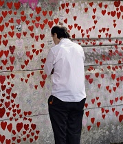 England, London, Westminster, UK, 3rd October 2023. The National Covid Memorial Wall. Public mural on the South Bank of the River Thames, with over 230,00 pink and red hearts.