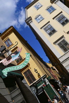 Sweden, Stockholm, The Old Town, Slingerbulten seafood restaurant sign.