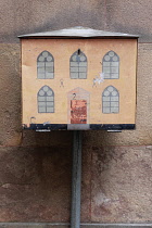 Sweden, Stockholm, The Old Town decorated utility meter unit.