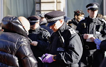 England, London, Whitehall, Police stop and search suspected right wing supporters under section 60 criminal justice and public order act.