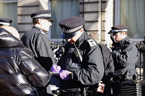 England, London, Whitehall, Police stop and search suspected right wing supporters under section 60 criminal justice and public order act.