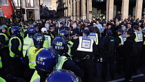 England, London, Parliament Square, Riot police and public order police contain a group of right wing supporters.