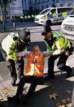 England, London, Whitehall, Just Stop Oil march and rally, protesters we arrested for stopping the traffic outside Downing Street, 23rd November 2023.