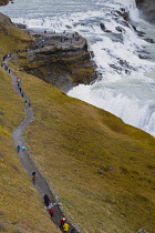 Iceland, Golden Circle, Thingvellir National Park in Autumn colours. The Mid-Atlantic Rift between the North American and Eurasian tectonic plates. Gullfloss Waterfall, the Golden Falls on the River H...