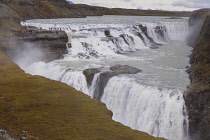 Iceland, Golden Circle, Thingvellir National Park in Autumn colours. The Mid-Atlantic Rift between the North American and Eurasian tectonic plates. Gullfloss Waterfall, the Golden Falls on the River H...