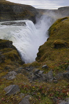 Iceland, Golden Circle, Thingvellir National Park in Autumn colours. The Mid-Atlantic Rift between the North American and Eurasian tectonic plates. Gullfloss Waterfall, the Golden Falls on the River H...