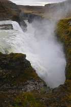 Iceland, Golden Circle, Thingvellir National Park in Autumn colours. The Mid-Atlantic Rift between the North American and Eurasian tectonic plates. Gullfloss Waterfall, the Golden Falls on the River H...