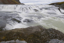 Iceland, Golden Circle, Thingvellir National Park in Autumn colours. The Mid-Atlantic Rift between the North American and Eurasian tectonic plates. Gullfloss Waterfall, the Golden Falls on the River H...