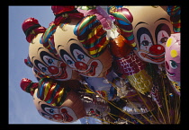 Children, Play, Balloons, Close up of helium ballons in the shape of clowns faces  for sale at the Bognor Regis clown convention.