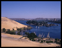 Egypt, Aswan, Kitcheners Island, Also known as the Island of Plants. View along coast toward feluccas on the River Nile.
