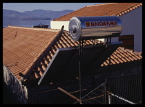 Greece, Lesvos, Solar water heater on building roof.