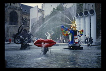 France, Ile de France, Paris, Pompidou Centre.  Exterior with fountains and artwork.