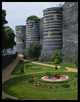 France, Maine-et-Loire, Angers, Chateau d Angers formal gardens and towers.