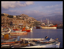 Greece, N. E. Aegean, Lesvos, Molyvos.  Harbour with fishing boats and houses on hillside behind.