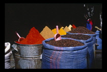 Morocco, Marrakesh, Markets, Spices displayed in sacks at market stall.