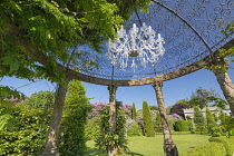 Ireland, County Kerry, Tralee,  Ballyseede Castle Hotel Gardens near the town, pergola with chandelier.