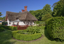 Ireland, County Kerry, Killarney, Killarney National Park, Deenagh Lodge dating from 1834 with beautiful features including a traditionally decorated thatched roof, overhanging eaves, verges, and Tudo...