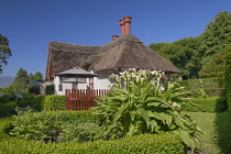 Ireland, County Kerry, Killarney, Killarney National Park, Deenagh Lodge dating from 1834 with beautiful features including a traditionally decorated thatched roof, overhanging eaves, verges, and Tudo...