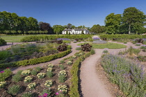 Ireland, County Kerry, Killarney, Killarney House and Gardens, ornamental gardens with Killarney House in the background.