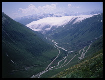 Italy, Veneto, Near Belluno, Lago Di Scroce and surrounding mountains.