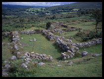 Wales, Denbighshire, Llangollen, View looking east over landscape through ruined archway of Castell Dinas Bran.