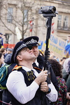 England, London, Police recording Ukraine demonstration in Trafalgar Square.