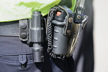 England, London, Law and Order, Detail of Police officers belt with torch and handcuffs.