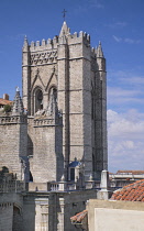 Spain, Castile and Leon, Avila, Avila Cathedral tower viewed from the walkway along the interior perimeter of the city walls that were built from 1090 onwards and are among the best-preserved and most...