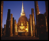 Thailand, Sukothai,  Loi Kratong Illuminated buddha at dusk.