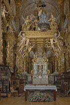 Spain, Galicia, Santiago de Compostela, the Cathedral of Santiago de Compostela,  Baldachin and highly decorated high altar with the famous Botafumeiro thurible out front.