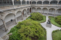 Spain, Galicia, Santiago de Compostela, University library courtyard with a statue of  Archbishop Alonso 3rd de Fonseca in the centre.