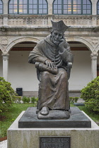 Spain, Galicia, Santiago de Compostela, University library courtyard with a statue of  Archbishop Alonso 3rd de Fonseca in the centre.