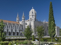 Portugal, Lisbon, Belem, Mosterio Dos Jeronimos or the Royal Monastery of Saint Mary of Belém, exterior facade of the monastery viewed from the Empire Square Garden.