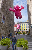 Canada, Quebec Province, Quebec City. Alley leading to Place Royale in Old Quebec City, Vieux Quebec in Basse-Ville or Lower Town. One of the inflatable Mr Pink, or Monsieur Rose S'Envole, sculptures...